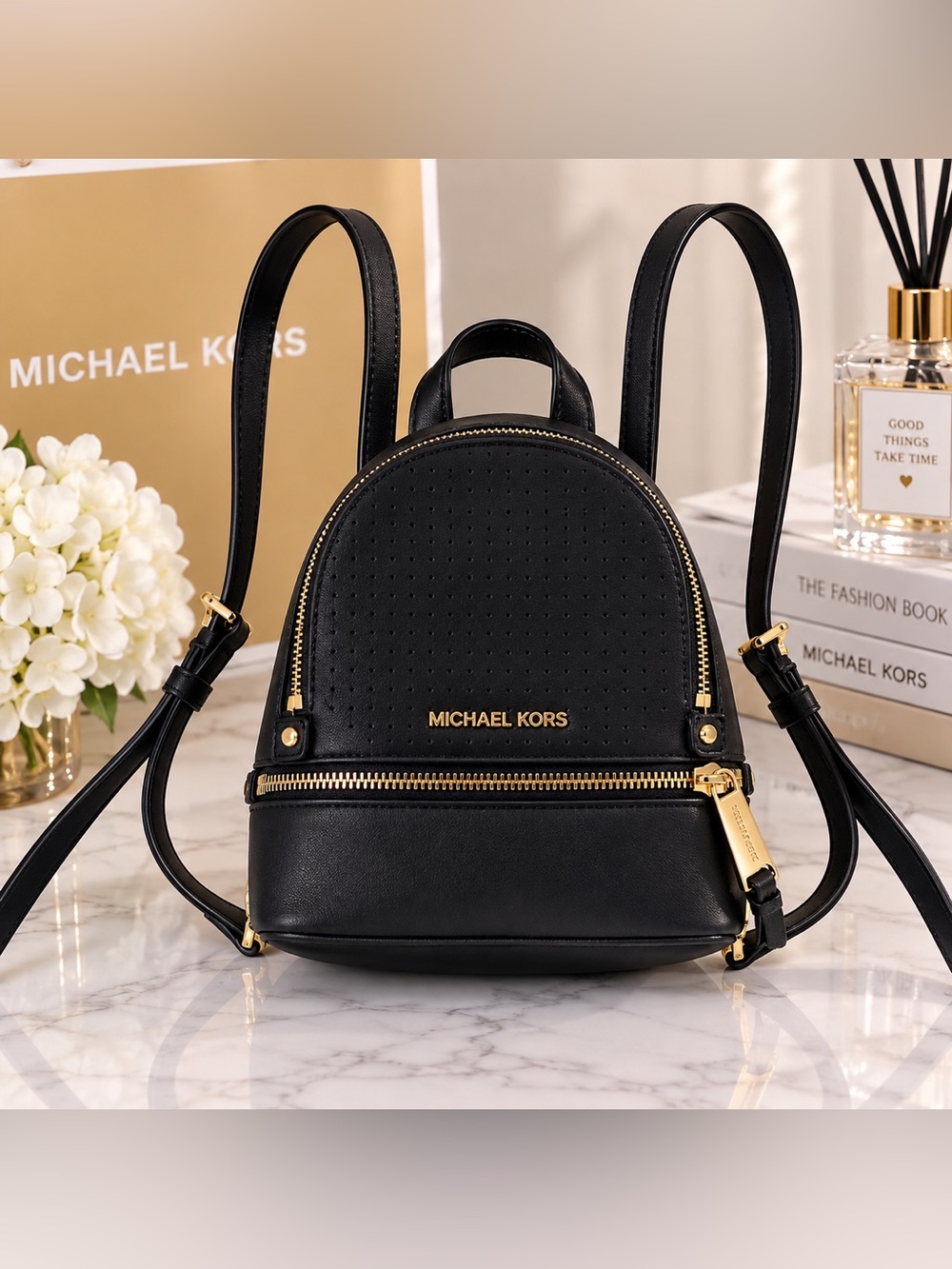 Michael Kors Black Mini Leather Backpack with Gold Details